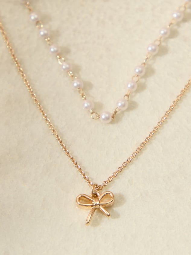 Gold Layered Necklace with Bow Pendant